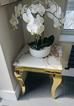 The SG-Lewis Lamp Table combines refined Italian design with practical functionality. Featuring four sleek contemporary legs and a polished chrome frame, this piece delivers understated elegance to any interior. Choose between luxurious marble or durable ceramic tops to suit your aesthetic and lifestyle needs. A versatile accent table that bridges modern minimalism with timeless sophistication.