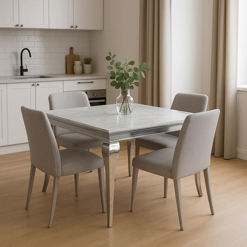 The Lewis 1m Square Dining Table combines refined Italian design with practical elegance. Its marble top provides a sophisticated, durable surface that resists staining and heat, whilst the polished chrome frame delivers a contemporary aesthetic with exceptional structural integrity. Four tapered legs in the Italian style create visual lightness whilst maintaining stability. Ideal for modern dining spaces, this compact square format accommodates intimate gatherings without compromising on style or quality 