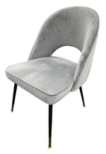 Gray velvet chair with black legs 