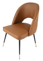 Brown leather chair with black legs 