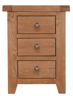 Solid oak wood bedside table with three drawers featuring brass-style knobs and tapered legs.